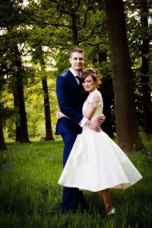 bride and groom holding each other